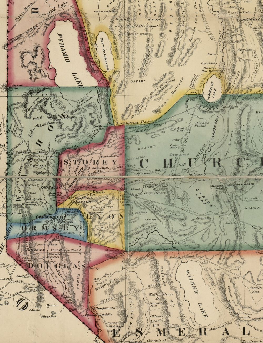 A hand-coloured map of western Nevada. Pyramid Lake at the top, with Indian Reservation lettered beside the Truckee River; Virginia City and the mining districts in the middle; the Pine Nut Range running south past Carson City; Walker Lake at the bottom.